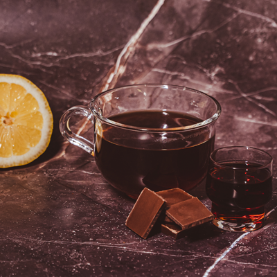 Black coffee with lemon, cognac or liqueur